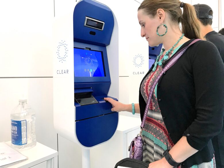 getting fingerprints checked at Clear kiosk at airport security